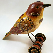 The Fat Finch Boutique for Bird Lovers | Bird with Locket on Bocce Ball Sculpture by Mullanium